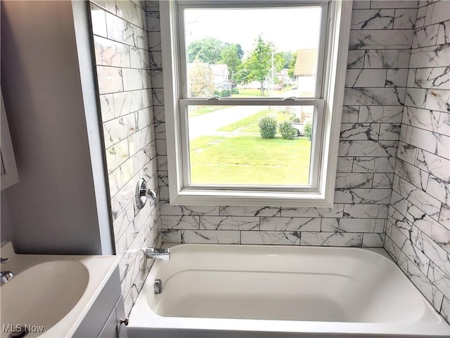 full bathroom with a bath and a sink