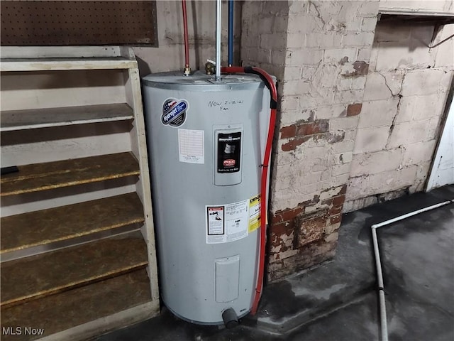 utility room featuring water heater