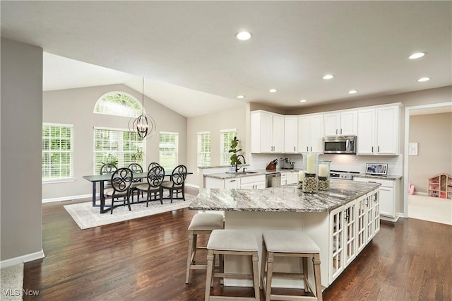 1284 Spafford Dr, Copley, OH 44321 - kitchen with appliances with stainless steel finishes, a sink, dark wood-style floors, white cabinetry, and recessed lighting