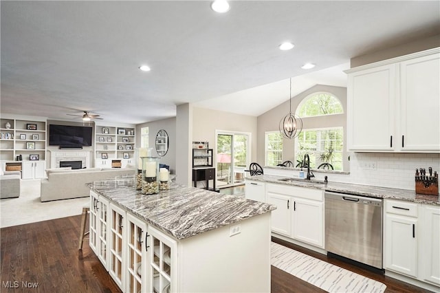 1284 Spafford Dr, Copley, OH 44321 - kitchen featuring dishwasher, ceiling fan, a center island, a sink, and a fireplace