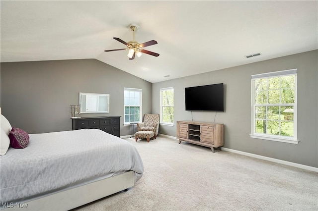 1284 Spafford Dr, Copley, OH 44321 - carpeted bedroom featuring baseboards, lofted ceiling, multiple windows, and a ceiling fan