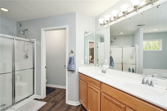 1284 Spafford Dr, Copley, OH 44321 - full bath featuring a shower stall, wood finished floors, double vanity, baseboards, and toilet