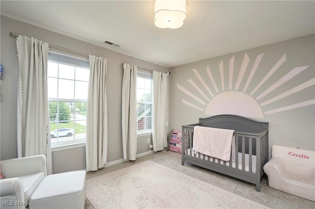 1284 Spafford Dr, Copley, OH 44321 - carpeted bedroom with a nursery area and baseboards
