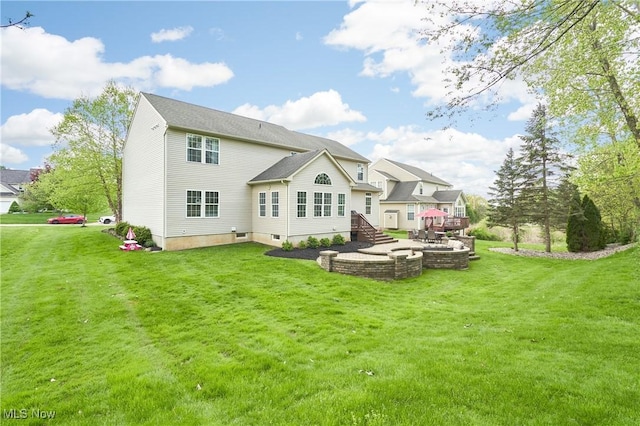 1284 Spafford Dr, Copley, OH 44321 - rear view of house featuring a yard and an outdoor fire pit