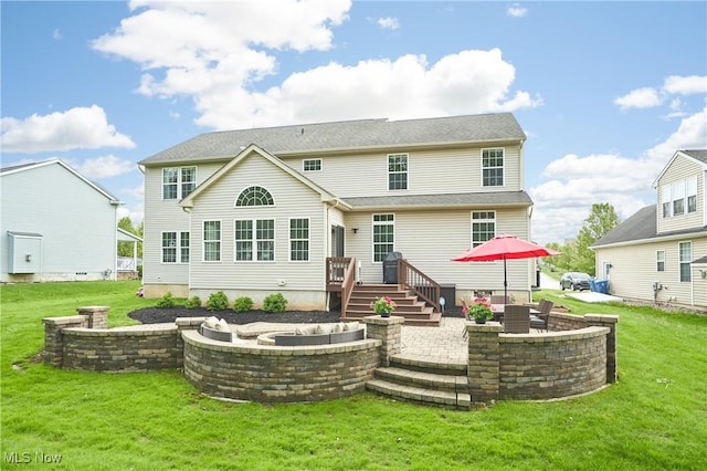 1284 Spafford Dr, Copley, OH 44321 - rear view of property with a patio area, a fire pit, a yard, and a deck