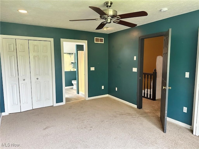 unfurnished bedroom featuring carpet floors, baseboards, a closet, recessed lighting, and a textured ceiling