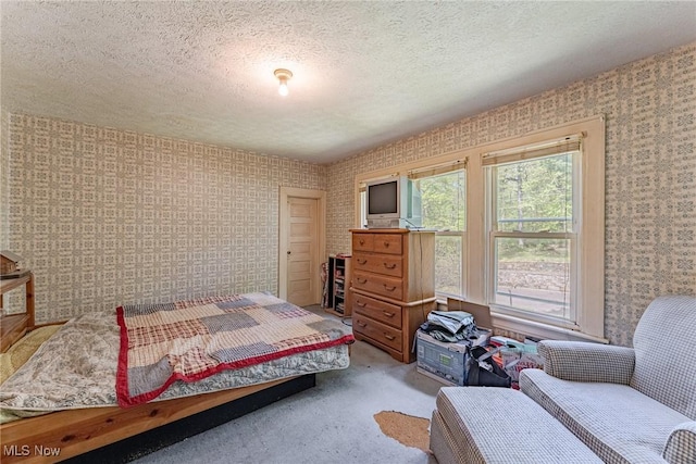 1056 Garman Rd, Akron, OH 44313 - carpeted bedroom with wallpapered walls and a textured ceiling