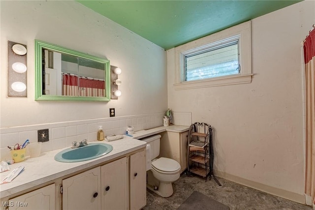 1056 Garman Rd, Akron, OH 44313 - bathroom featuring toilet, vanity, and a shower with shower curtain