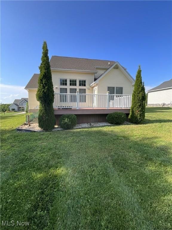 1245 Sageberry Dr, North Lima, OH 44452 - rear view of house with a deck and a lawn