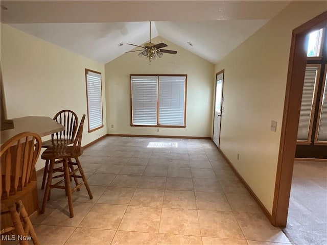 1245 Sageberry Dr, North Lima, OH 44452 - dining room featuring ceiling fan, vaulted ceiling, and light tile patterned flooring
