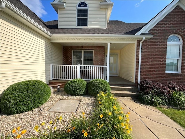 1245 Sageberry Dr, North Lima, OH 44452 - entrance to property with a porch, brick siding, and roof with shingles