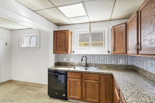 7700 Spring Garden Rd, Parma, OH 44129 - kitchen with a sink, dishwasher, tasteful backsplash, and light colored carpet