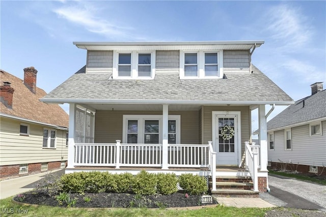 7700 Spring Garden Rd, Parma, OH 44129 - bungalow-style home featuring a porch and roof with shingles