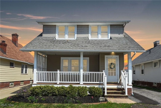 7700 Spring Garden Rd, Parma, OH 44129 - view of front facade featuring a porch and a shingled roof