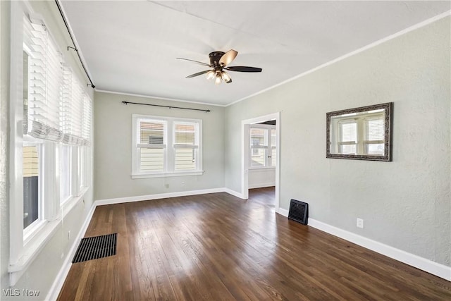 7700 Spring Garden Rd, Parma, OH 44129 - unfurnished living room with ceiling fan, wood finished floors, crown molding, and baseboards