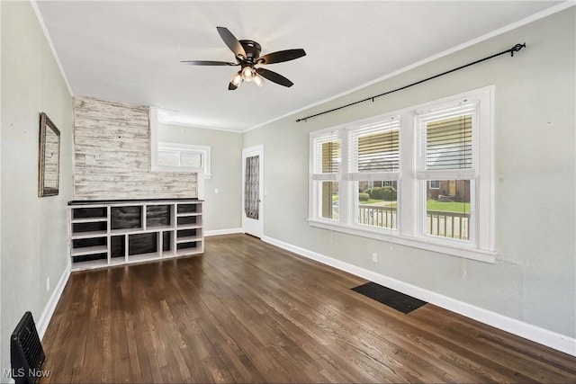 7700 Spring Garden Rd, Parma, OH 44129 - unfurnished living room featuring crown molding, ceiling fan, wood finished floors, and baseboards