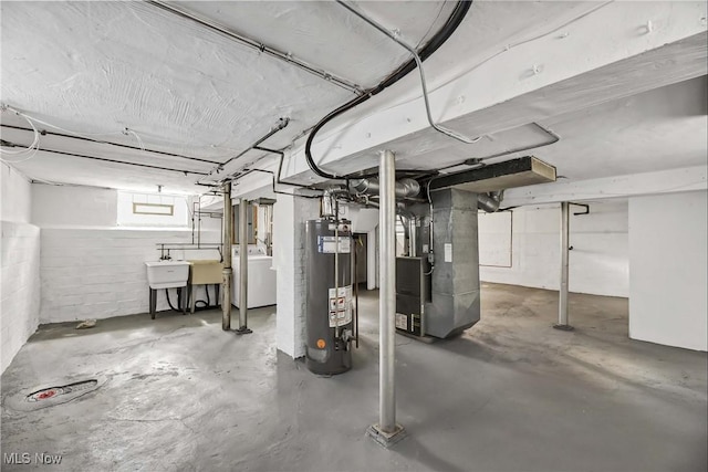 7700 Spring Garden Rd, Parma, OH 44129 - basement featuring water heater, washer / clothes dryer, and heating unit