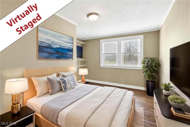 7700 Spring Garden Rd, Parma, OH 44129 - bedroom featuring wood finished floors, baseboards, and crown molding