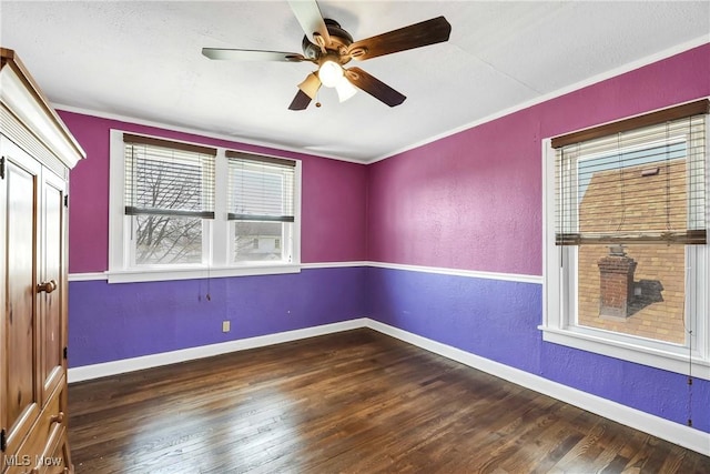 7700 Spring Garden Rd, Parma, OH 44129 - unfurnished room with wood finished floors, baseboards, a ceiling fan, and crown molding