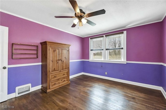 7700 Spring Garden Rd, Parma, OH 44129 - unfurnished bedroom with wood finished floors, ornamental molding, baseboards, ceiling fan, and a textured ceiling