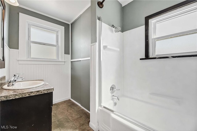 7700 Spring Garden Rd, Parma, OH 44129 - full bath featuring tub / shower combination, vanity, a wainscoted wall, and crown molding