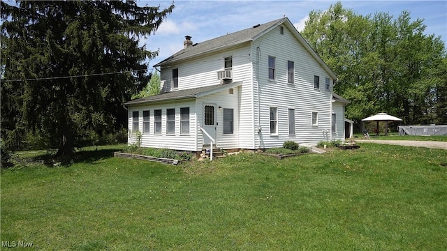 15561 Georgetown St NE, Minerva, OH 44657 - view of property exterior with a chimney and a yard