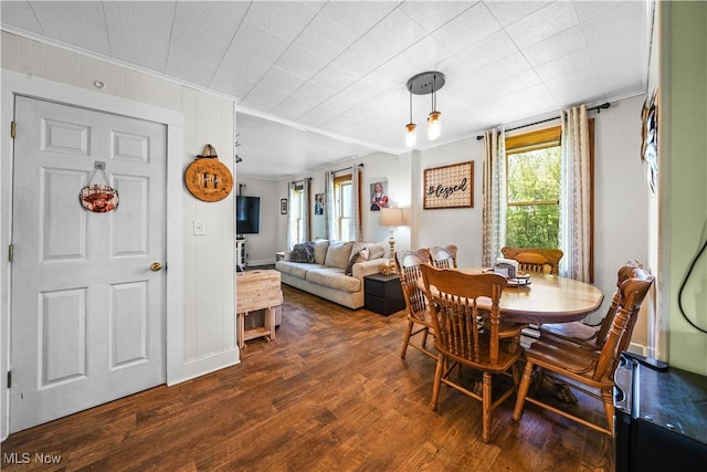 15561 Georgetown St NE, Minerva, OH 44657 - dining room featuring ornamental molding and dark wood-style floors