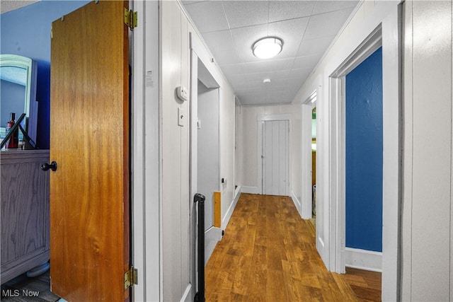 15561 Georgetown St NE, Minerva, OH 44657 - hall with wood finished floors, baseboards, and a drop ceiling