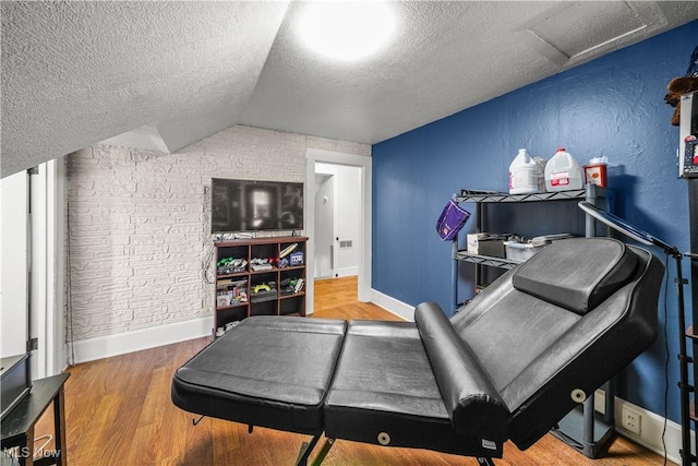 15561 Georgetown St NE, Minerva, OH 44657 - bedroom featuring a textured ceiling, wood finished floors, vaulted ceiling, attic access, and baseboards