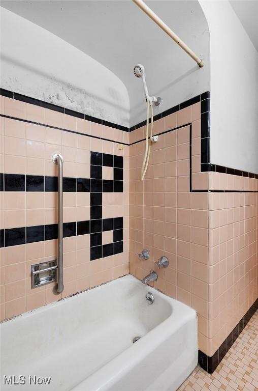 6119 E Sprague Rd, Independence, OH 44131 - full bath with washtub / shower combination and tile walls