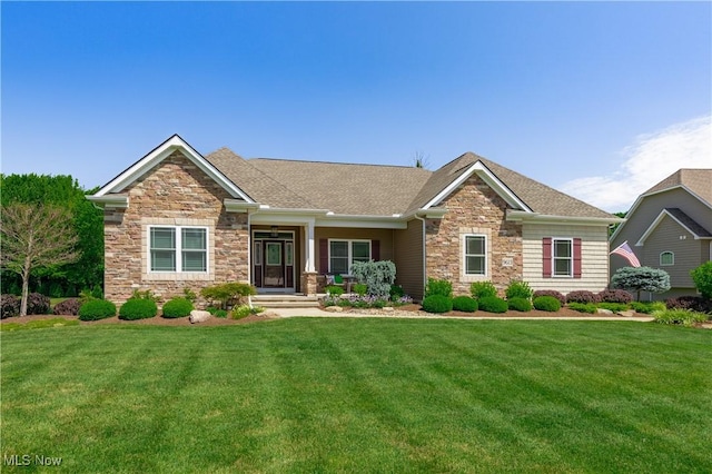 craftsman inspired home featuring stone siding and a front yard