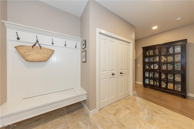 mudroom featuring baseboards and recessed lighting
