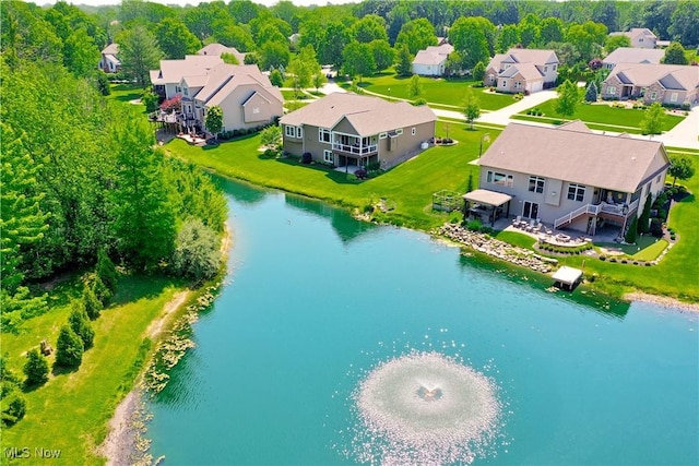 aerial view of residential area with a nearby body of water