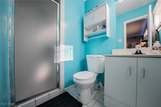 24660 Sittingbourne Ln, Beachwood, OH 44122 - full bath featuring vanity, toilet, a stall shower, tile patterned flooring, and healthy amount of natural light