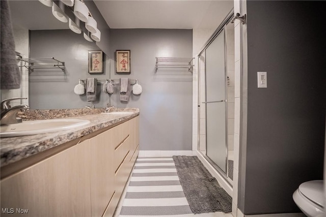 24660 Sittingbourne Ln, Beachwood, OH 44122 - full bath featuring a stall shower, double vanity, toilet, and baseboards