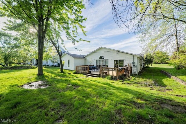 24660 Sittingbourne Ln, Beachwood, OH 44122 - rear view of property with a deck and a yard