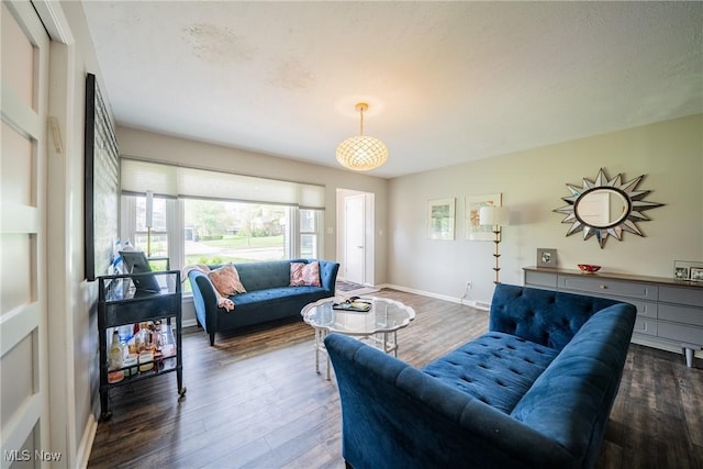 24660 Sittingbourne Ln, Beachwood, OH 44122 - living room featuring healthy amount of natural light, wood finished floors, and baseboards