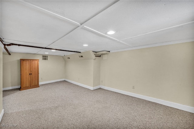 finished basement with light colored carpet, recessed lighting, and baseboards