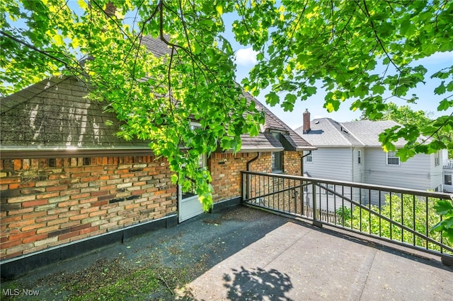 view of patio featuring a balcony