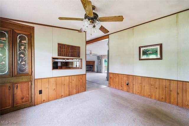 9493 State Route 9, Hanoverton, OH 44423 - carpeted empty room featuring ceiling fan, wooden walls, and wainscoting