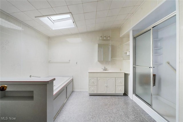 9493 State Route 9, Hanoverton, OH 44423 - bathroom featuring a skylight, a shower stall, vanity, and a garden tub