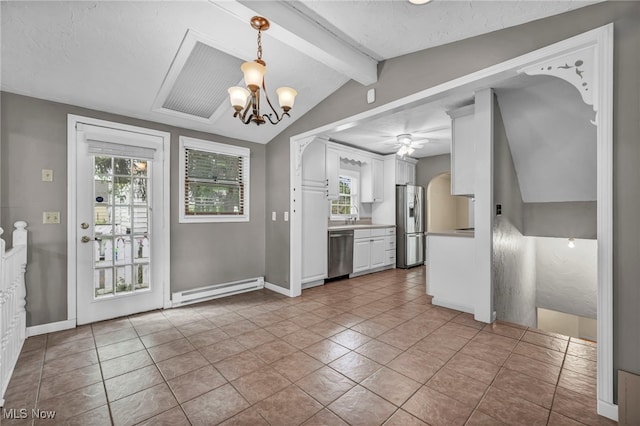 kitchen featuring appliances with stainless steel finishes, baseboard heating, white cabinetry, and healthy amount of natural light