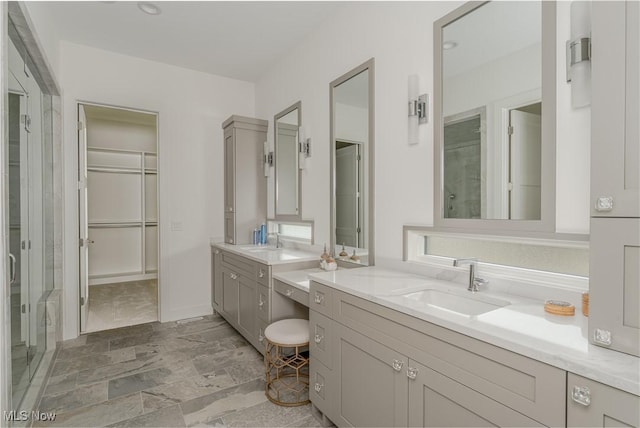 bathroom with two vanities and a shower stall
