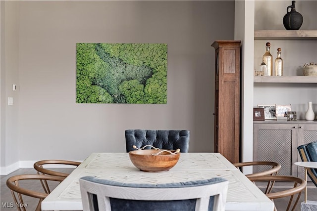 dining room with baseboards
