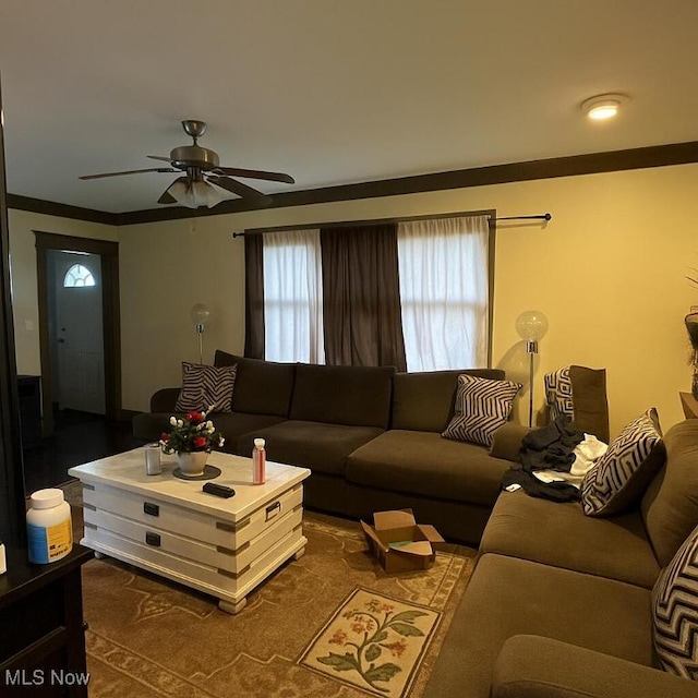 living area featuring ceiling fan