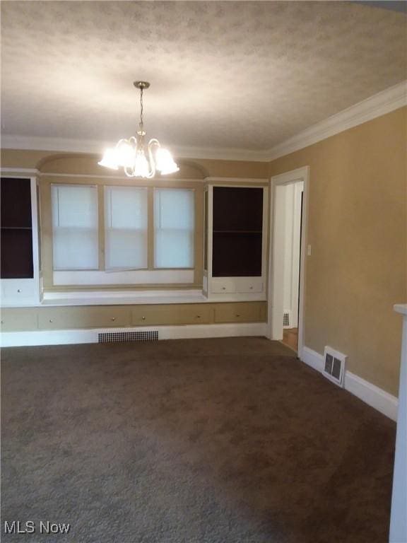 unfurnished room featuring ornamental molding, a chandelier, carpet floors, and baseboards