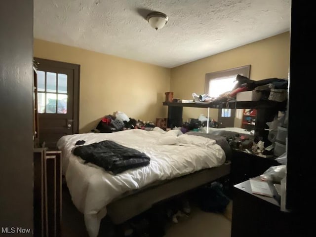 bedroom featuring a textured ceiling