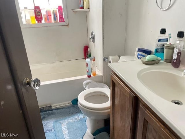 full bath featuring toilet, vanity, and  shower combination
