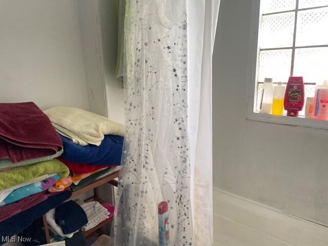 bathroom with a shower with shower curtain