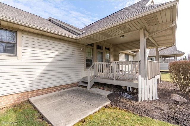 847 Beverly Ave, Canal Fulton, OH 44614 - doorway to property with a shingled roof, a deck, and a patio area